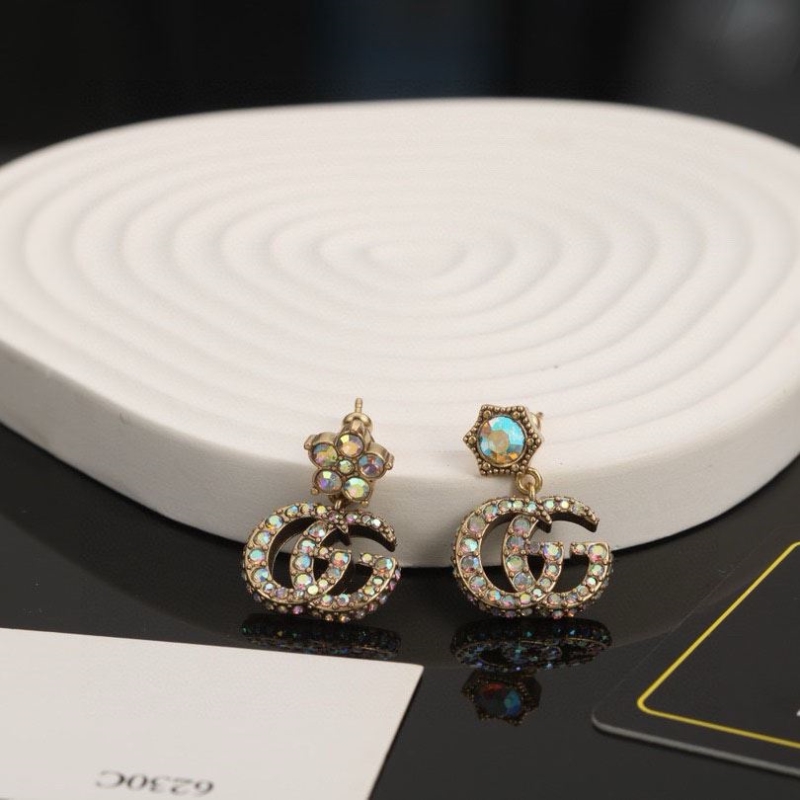 G*u*i earrings